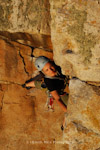 Ruth Rose negotiating the roof on Margin, VS 4c, Lindy Island, England.