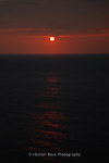 Blood red sunset off Lundy Island, England.