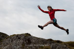 Fell runner Emma Warren leaping a gap. North Wales.